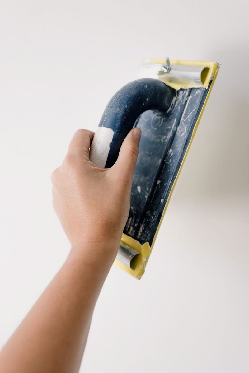 Hand sanding a filled wall smooth