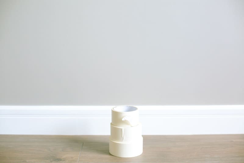 Masking tape along a freshly painted skirting board